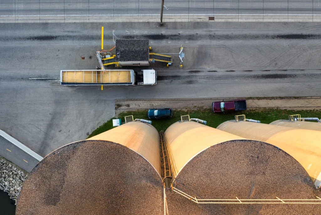 Aerial view of industrial silos next to a truck at a grain facility in Red Wing, Minnesota.